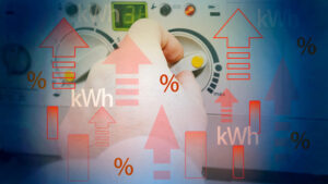 A hand turns a knob on a machine using energy. Up arrows represent peak load reduction strategies as part of an energy risk management plan.