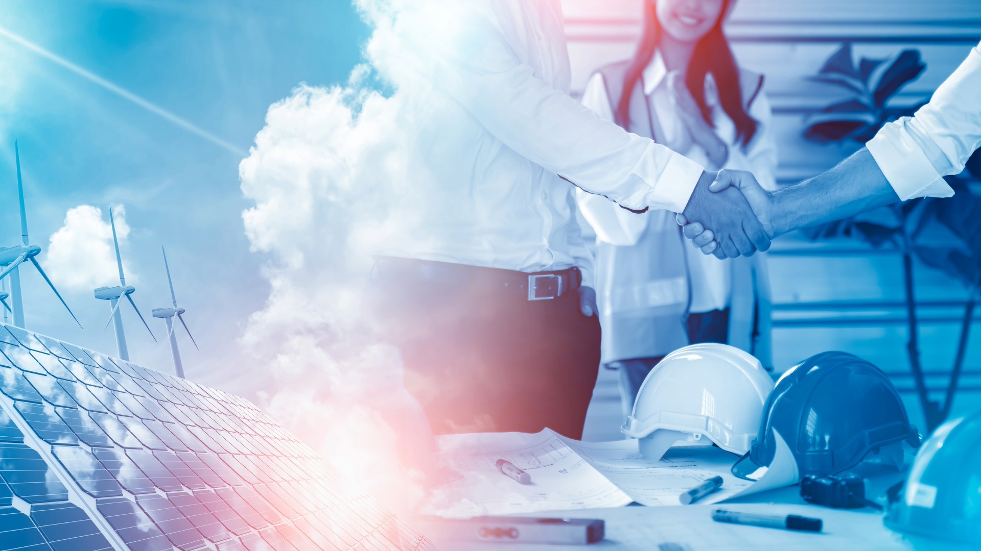 Two energy procurement specialists shake hands, with renewable energy procurement options like wind and solar power appearing in the background.