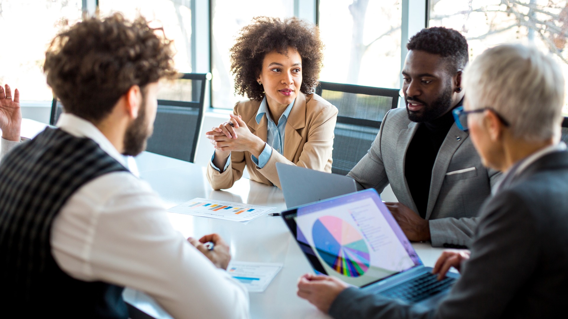 Company stakeholders review an energy procurement plan