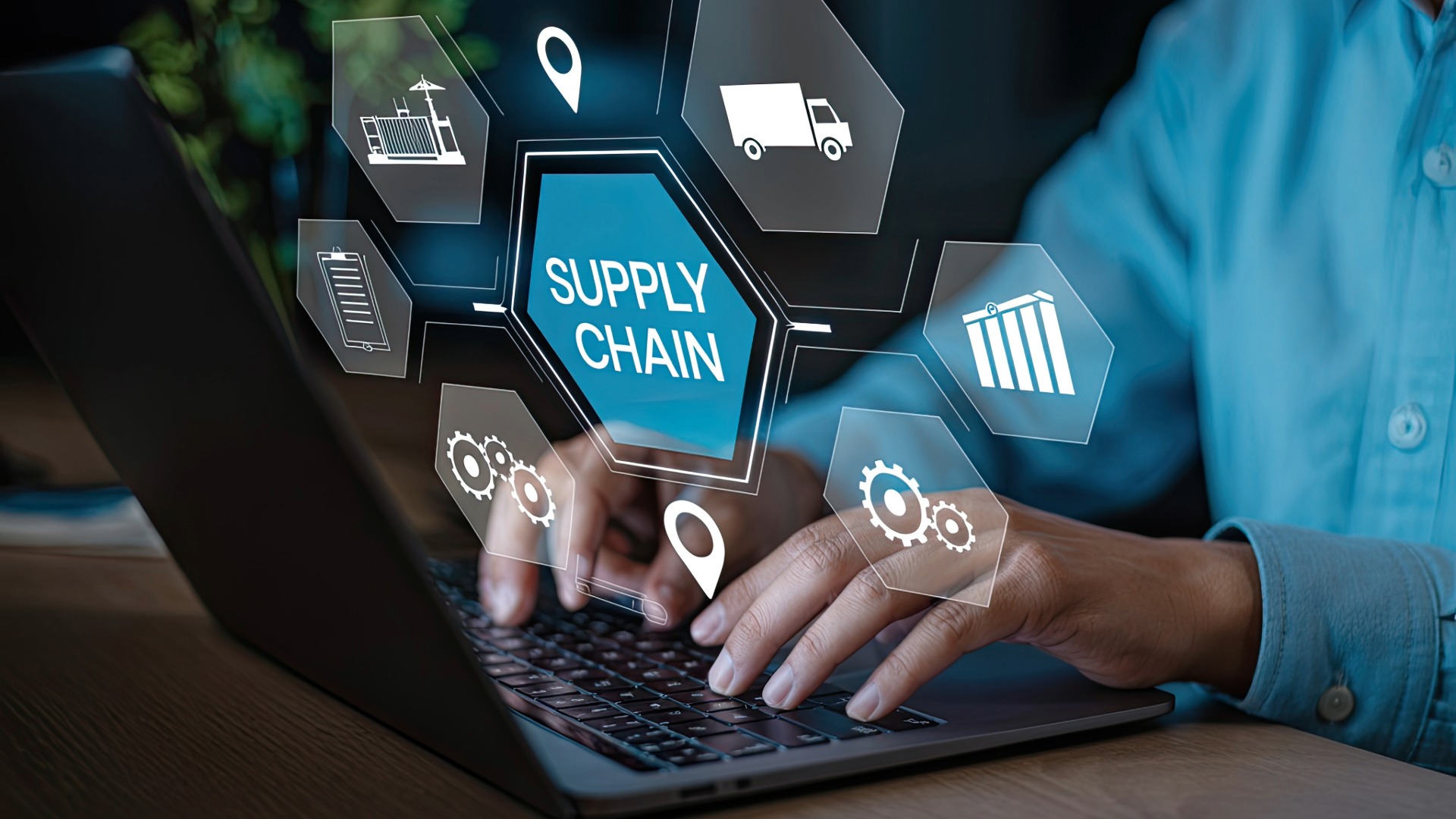 An energy procurement specialist uses a data analysis program on his laptop.