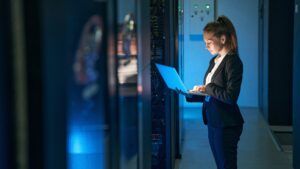 An energy procurement specialist measures energy shifts in an AI data center.